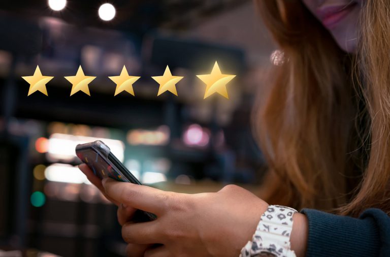 Woman Reviewing Star Rating Mobile Phone Woman Reviewing Star Rating Mobile Phone